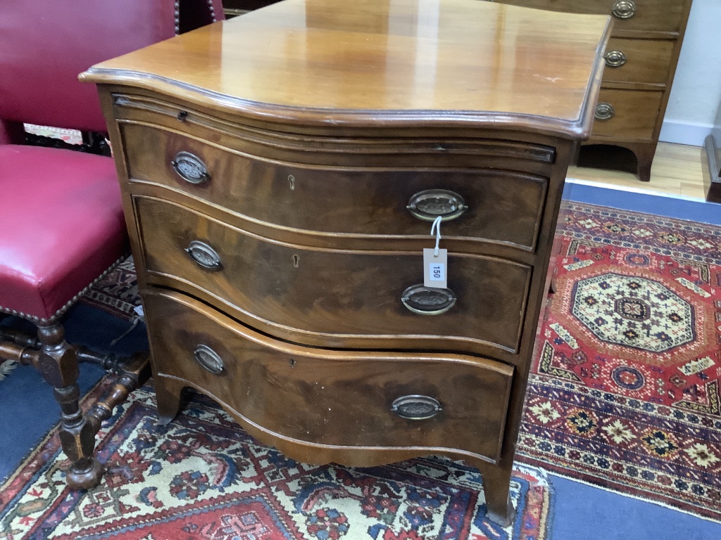 A George III design mahogany serpentine chest, fitted brushing slide and three drawers, width 77cm depth 49cm height 76cm